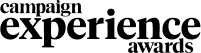 A person sits on a chair at a desk, working on a laptop—perhaps brainstorming for an immersive marketing agency. A cup rests on the desk and a picture frame hangs on the wall, all depicted in simple black and white line art.