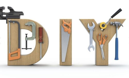 The letters DIY are made of wood, each decorated with various tools like a saw, screwdriver, and wrench—perfect inspiration for a marketing team promoting do-it-yourself projects.