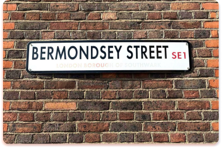 A street sign reading BERMONDSEY STREET SE1 is mounted on a red brick wall, serving as an urban contact collider where histories meet. The faded text below says London Borough of Southwark.