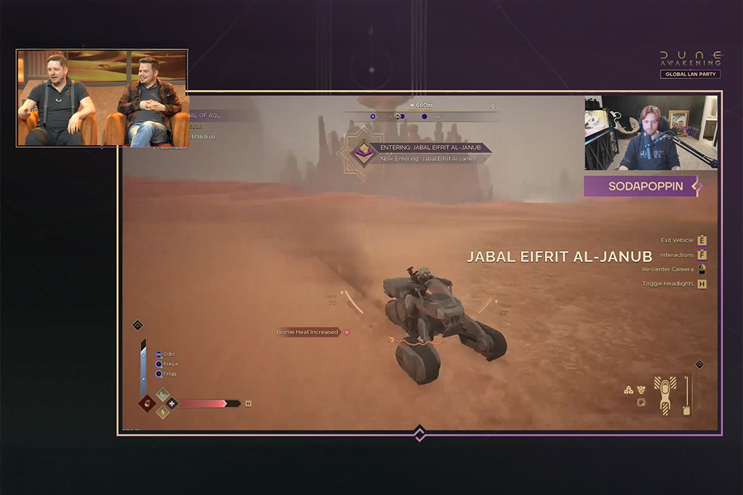 A video game livestream shows two hosts in the top left corner and gameplay of a vehicle driving through a desert landscape labeled Jabal Eifrit Al-Janub on the main screen, with the username SODAPOPPIN visible.
