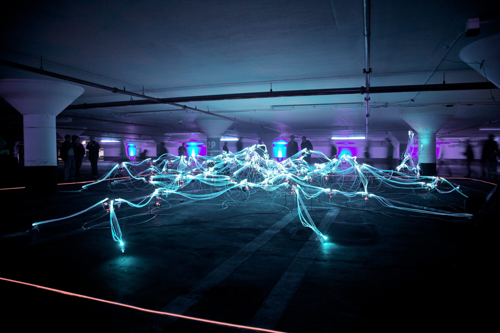 An image of neon light mapping in a large open space