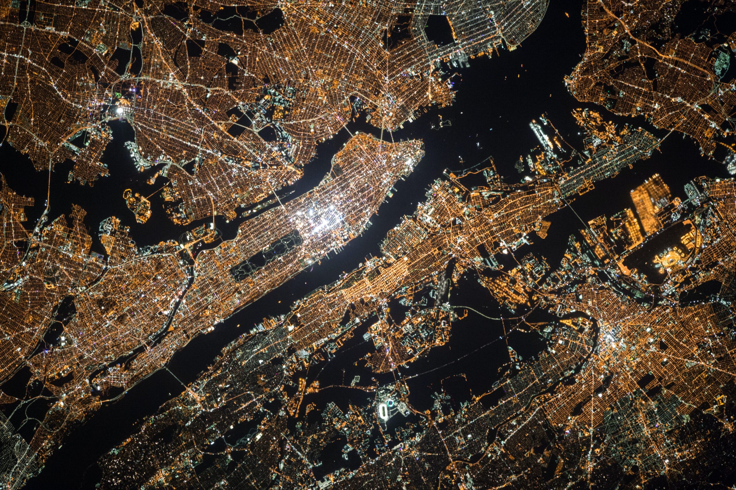 a birds-eye view, night time image of a global trendy city